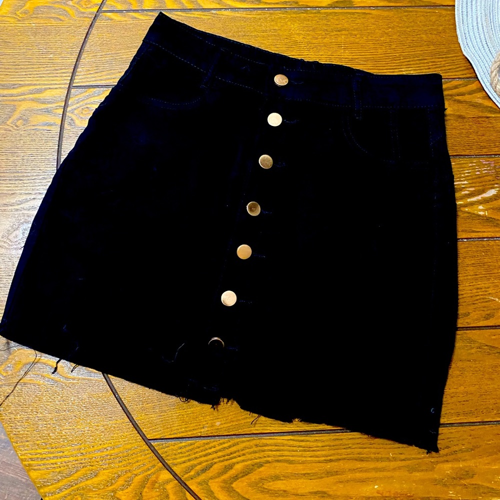 Black mini skirt with buttons down the front,